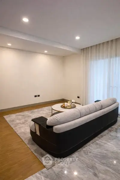 Spacious modern living room with elegant sofa and coffee table