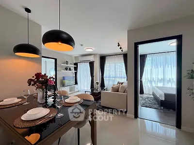 Modern open-plan living room and dining area with elegant decor and natural light
