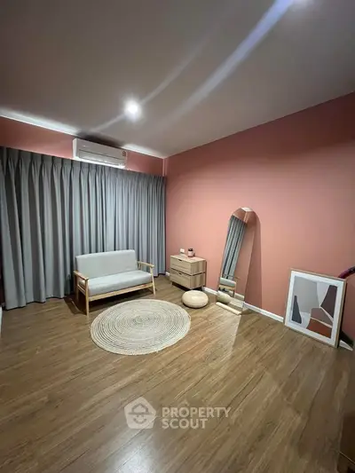 Stylish minimalist living room with wooden flooring and modern decor