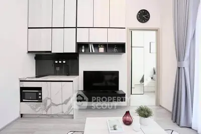 Modern minimalist living room with sleek kitchen and stylish decor
