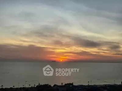 Stunning ocean view at sunset from a high-rise building, perfect for serene living.