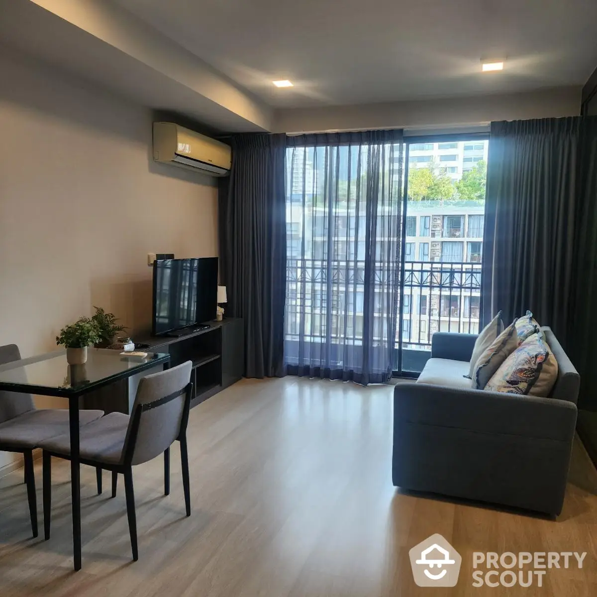 Modern living room with balcony view in urban apartment