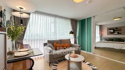 Modern open-plan living room with cozy seating and stylish decor