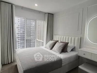 Modern bedroom with elegant decor and city view