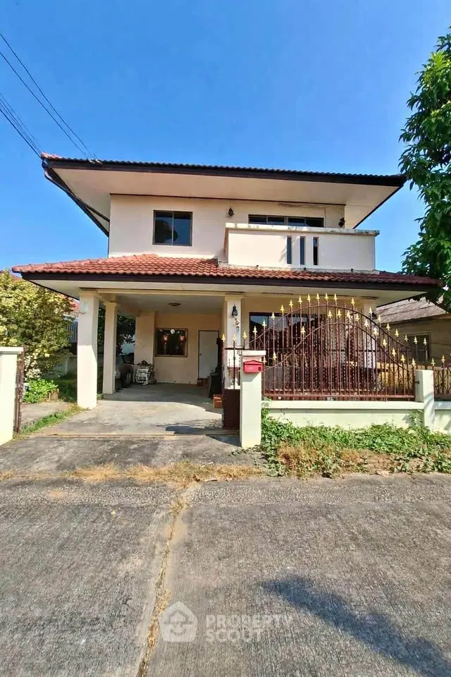 Charming two-story house with gated entrance and spacious driveway