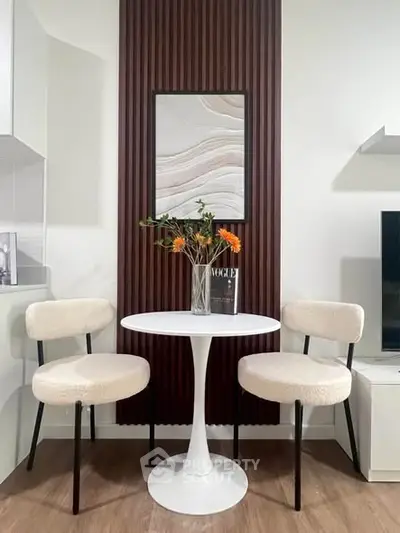 Stylish modern living room corner with elegant chairs and table