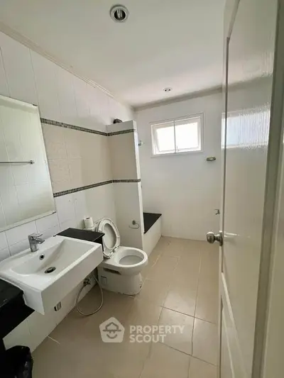 Spacious bathroom with modern fixtures and natural light