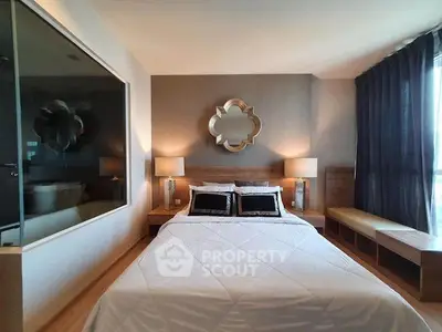 Luxurious bedroom with elegant decor and large window for natural light