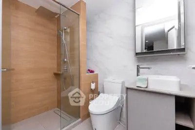 Modern bathroom with glass shower and sleek fixtures