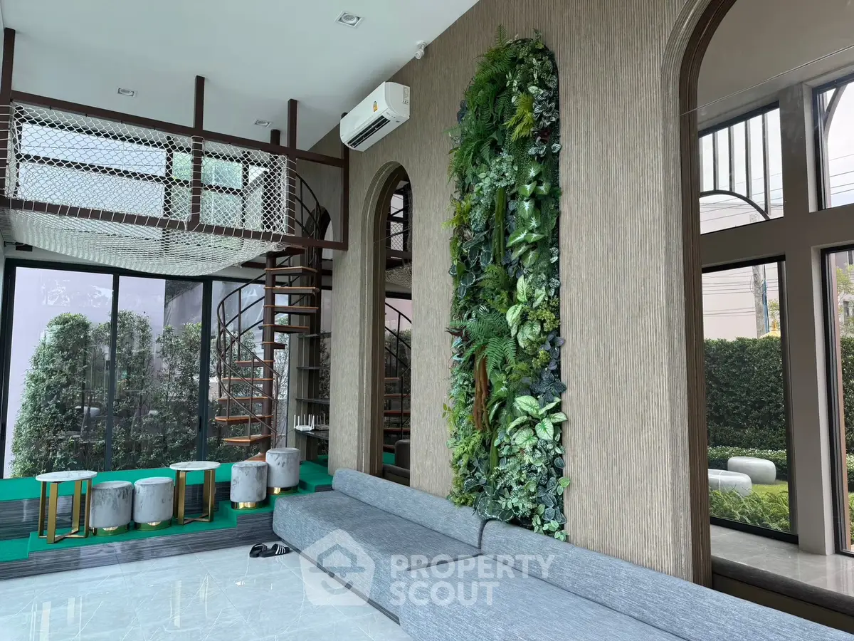 Luxurious modern living room with spiral staircase and vertical garden wall