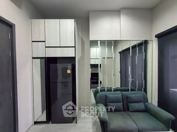 Modern living room with sleek furniture and built-in storage cabinets