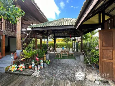 Charming rustic outdoor patio with lush greenery and wooden decor