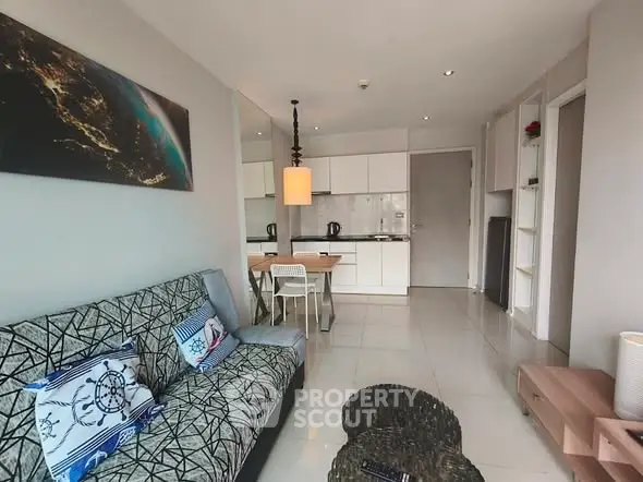 Modern living room with open kitchen layout and stylish decor