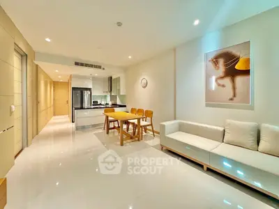 Modern open-plan living room with sleek kitchen and stylish decor