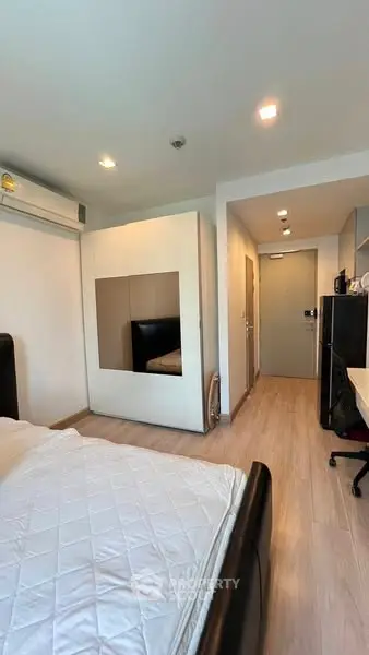 Modern bedroom with sleek design and ample natural light