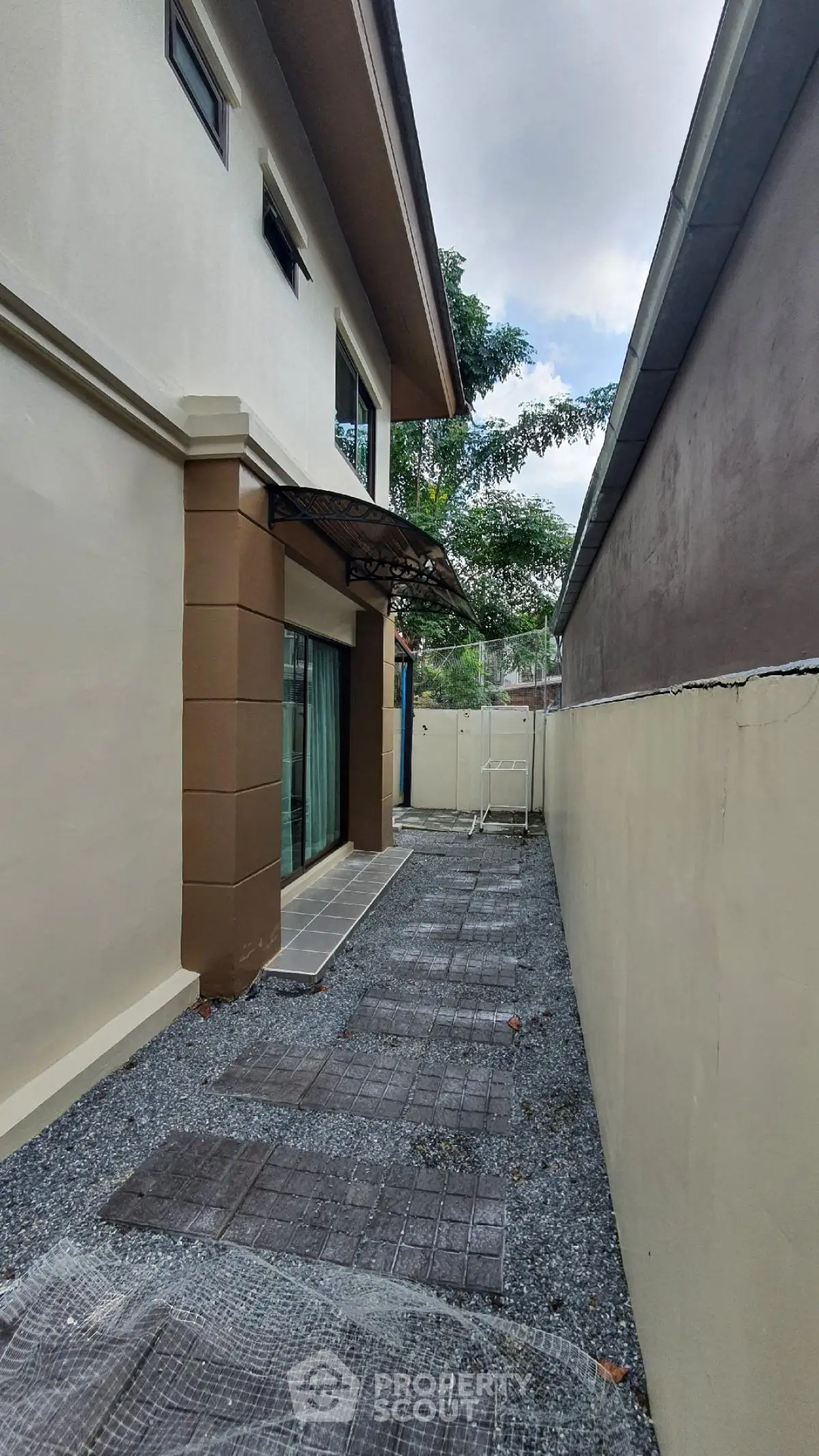 Modern exterior side pathway with sleek design and neutral colors