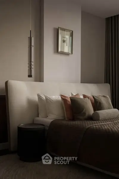 Luxurious bedroom with elegant decor and plush bedding, perfect for relaxation and comfort.
