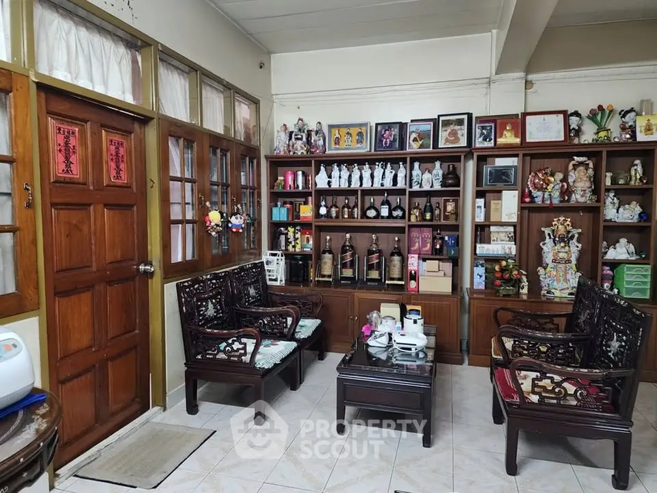 Charming living room with traditional wooden furniture and decorative shelves