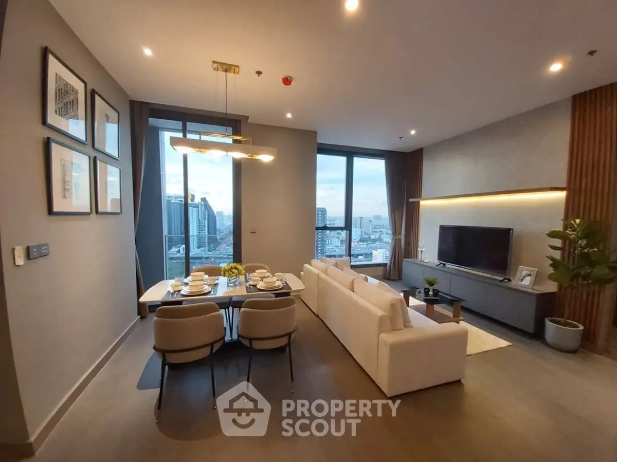 Luxurious modern living room with city view, elegant dining area, and stylish decor.