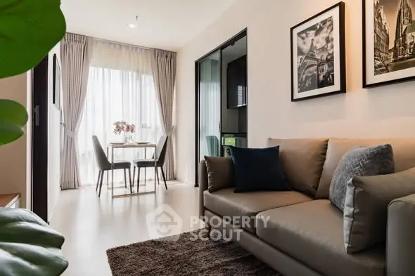 Modern living room with cozy sofa and dining area in stylish apartment.