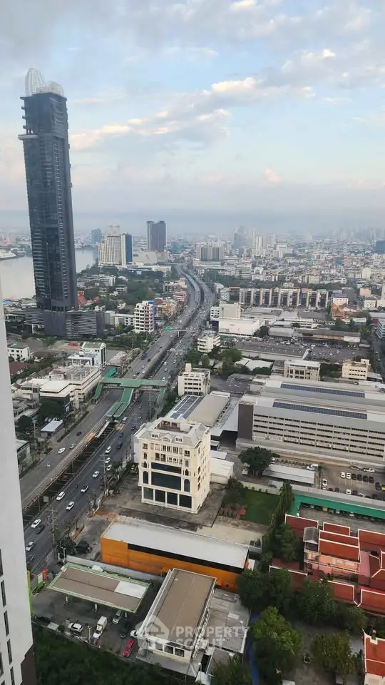 Stunning cityscape view from high-rise building showcasing urban skyline and bustling streets.