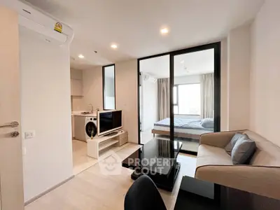 Modern apartment interior with cozy living room and open kitchen layout