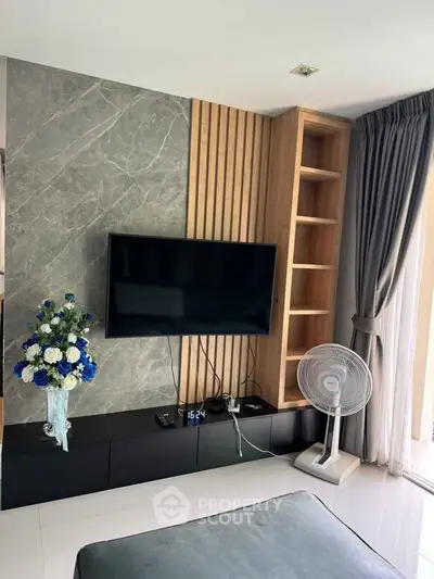 Modern living room with sleek TV setup and elegant decor