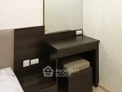 Modern bedroom with sleek wooden vanity and mirror