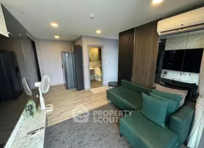 Modern living room with green sofa and sleek design