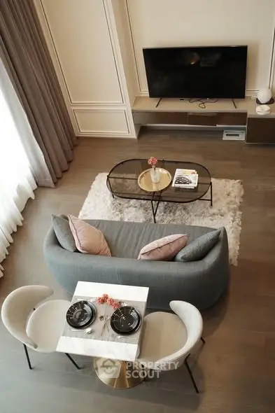 Stylish modern living room with elegant decor and cozy seating area.