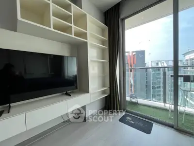 Modern living room with balcony view in high-rise apartment