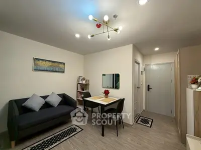 Modern living room with stylish decor and cozy seating area.