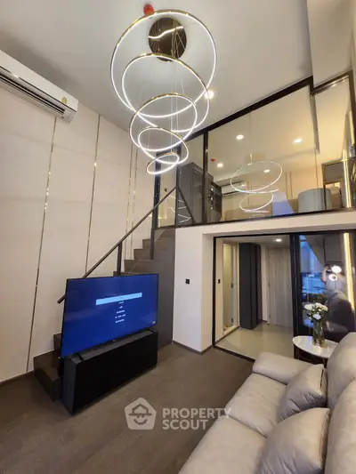 Modern duplex living room with stylish lighting and sleek design