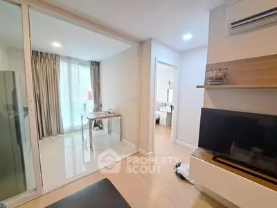 Modern apartment interior with open layout, featuring a cozy living area and stylish decor.