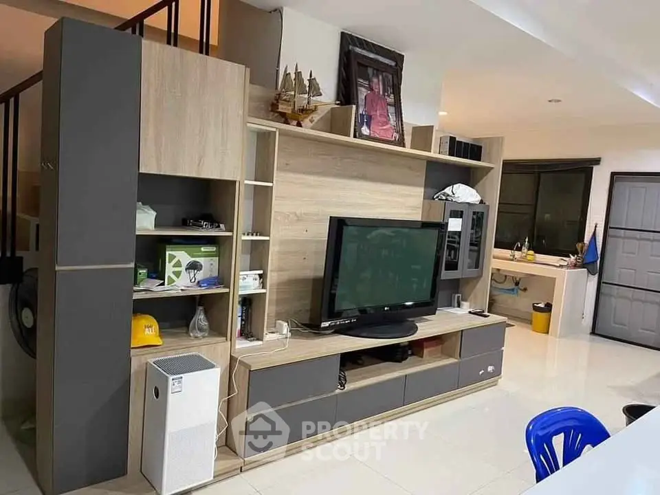Modern living room with stylish entertainment center and sleek decor
