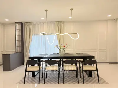 Elegant dining room with modern lighting and stylish decor