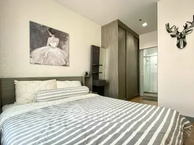 Modern bedroom with stylish decor and ample storage space