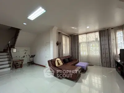 Spacious living room with modern decor and natural light