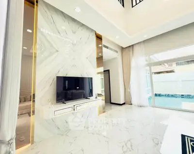 Luxurious living room with marble floors and pool view