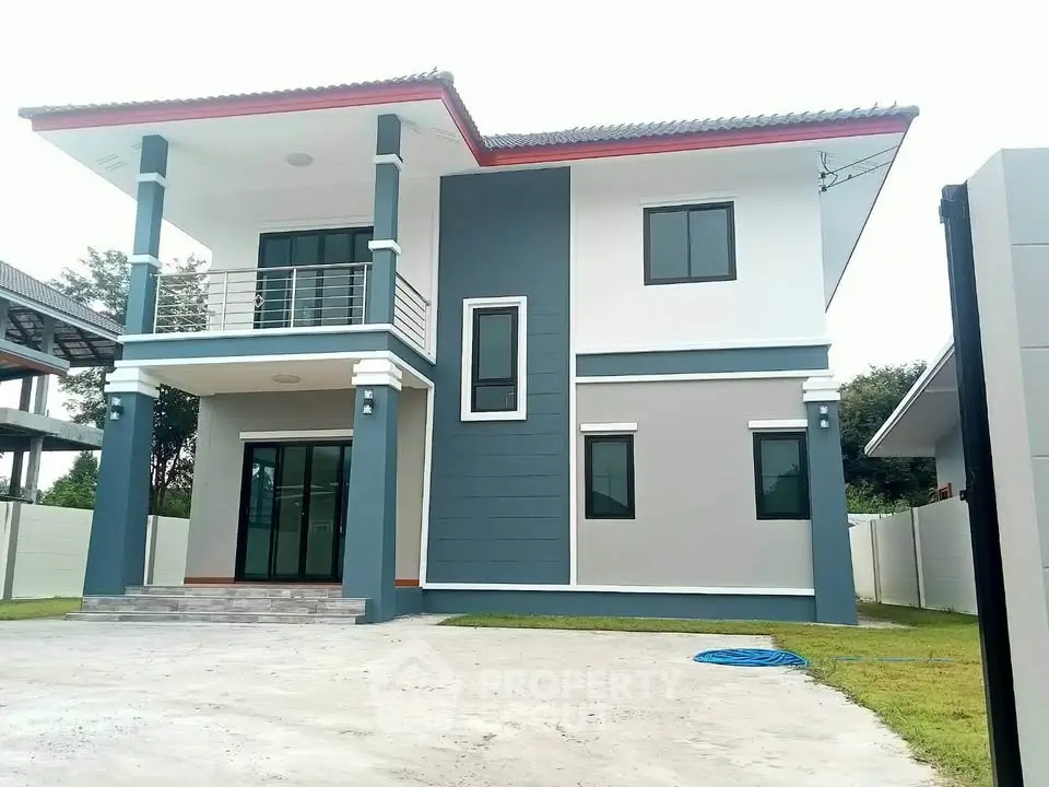 Modern two-story house with sleek design and spacious front yard