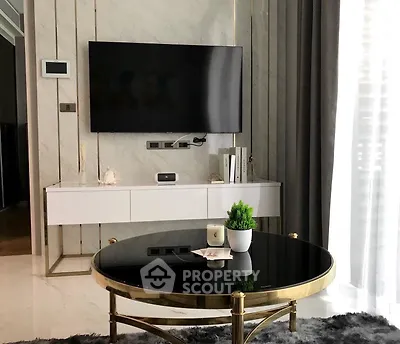 Modern living room with sleek TV setup and elegant decor