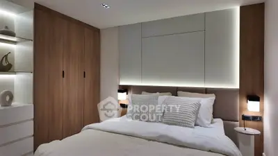 Modern bedroom with elegant lighting and wooden accents, featuring a cozy bed and stylish decor.