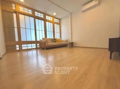 Spacious living room with wooden flooring and modern design