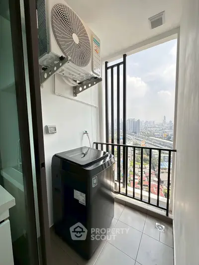 Modern apartment balcony with washing machine and city view