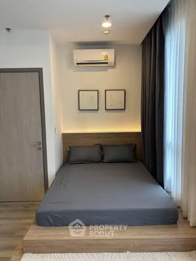 Modern bedroom with sleek design, featuring a cozy bed, stylish decor, and ambient lighting.
