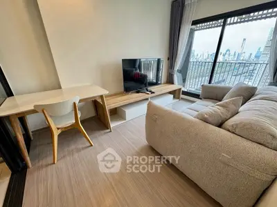 Modern living room with city view, cozy sofa, and stylish decor