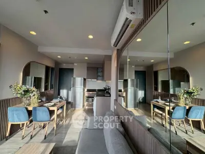 Modern open-layout living room with dining area and stylish decor