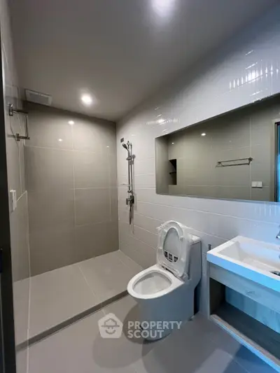 Modern bathroom with sleek tiles and contemporary fixtures