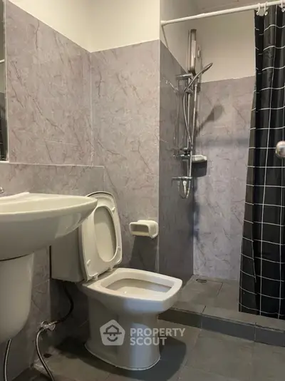 Modern bathroom with sleek fixtures and a spacious shower area