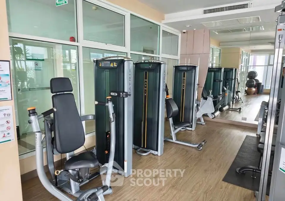 Modern gym with state-of-the-art fitness equipment in a residential building.